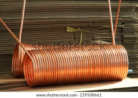 copper tube and liner board in a warehouse, in a manufacturing factory