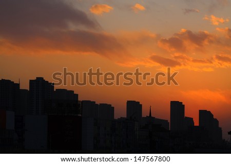 building under the setting sun in a city, china