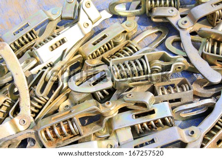 spring metal fittings stacked together, closeup of photo