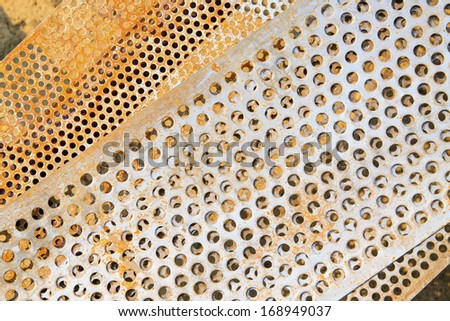 oxidation rust steel sieve, closeup of photo