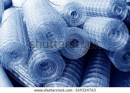 iron wire fence texture in a warehouse, closeup of photo