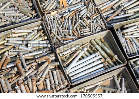 piles of expansion bolts in the iron box