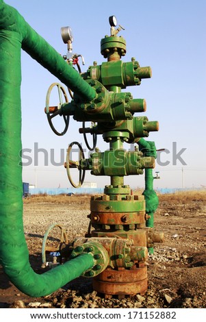 green insulation pipes and red valve, workplaces in the field, north china