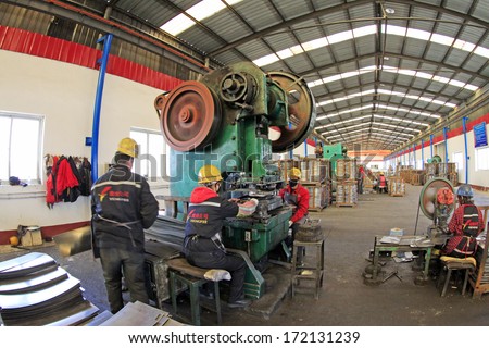 TANGSHAN, CHINA - DECEMBER 20: Blanking workshop production line, in a manufacturing enterprise, on December 20, 2013, tangshan city, hebei province, China.