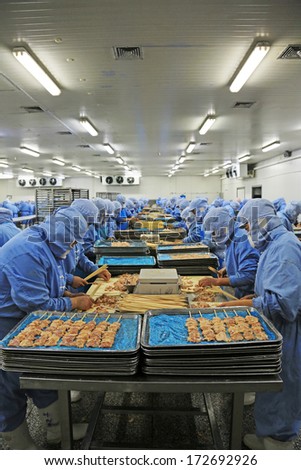 Tangshan - December 20: Workers In A Meat Processing Production Line, In A Food Processing Enterprise, On December 20, 2013, Tangshan City, Hebei Province, China.