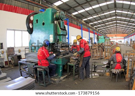 TANGSHAN - DECEMBER 20: Blanking workshop production line, in a manufacturing enterprise, on December 20, 2013, tangshan city, hebei province, China.