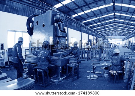 TANGSHAN, CHINA - DECEMBER 20: Blanking workshop production line, in a manufacturing enterprise, on December 20, 2013, tangshan city, hebei province, China.