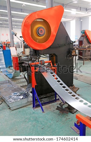 TANGSHAN - DECEMBER 22: The transmission device on the production line, in a solar equipment production workshop on december 22, 2013, tangshan, china.