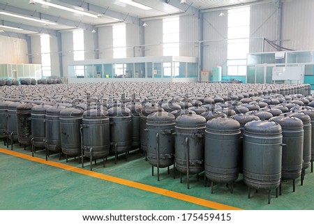 TANGSHAN - DECEMBER 22: pressure tank put in a warehouse workshop, in a solar equipment production workshop on december 22, 2013, tangshan, china.