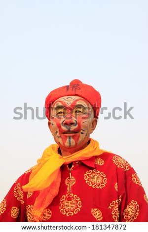 LUANNAN COUNTY - FEBRUARY 13: Sun wukong\'s image wearing colorful clothes, performing yangko dance in the street, February 13, 2014, Luannan County, Hebei Province, China.
