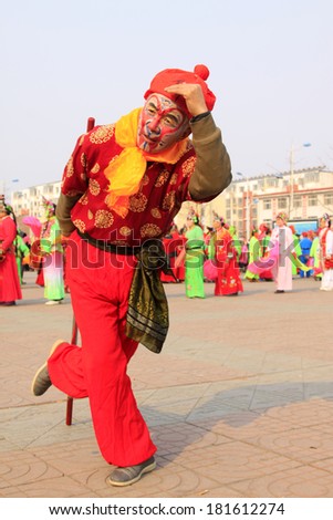 LUANNAN COUNTY - FEBRUARY 13: Sun wukong\'s image wearing colorful clothes, performing yangko dance in the street, February 13, 2014, Luannan County, Hebei Province, China.