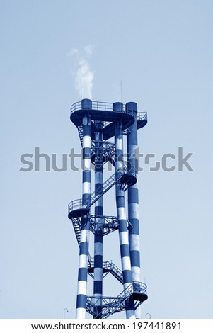 industrial smokestacks in the sky in a factory