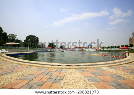 LUANNAN COUNTY - JULY 11: swimming pool in the water park, on july 11, 2014, Luannan county, Hebei Province, China