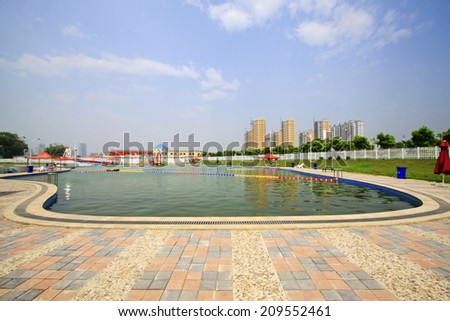 LUANNAN COUNTY - JULY 11: swimming pool in the water park, on july 11, 2014, Luannan county, Hebei Province, China