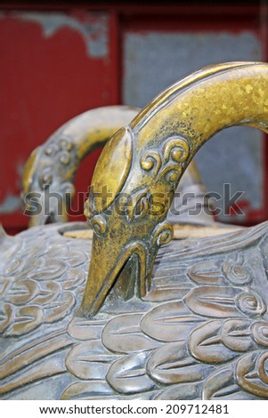 BEIJING - MAY 23: red-crowned crane bronze sculpture in the Beihai Park, on may 23, 2014, Beijing, China
