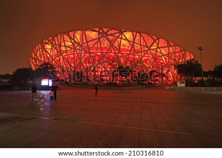 BEIJING - MAY 24: Beijing national stadium - the bird\'s nest at night, in the Beijing Olympic park, on may 24, 2014, Beijing, China