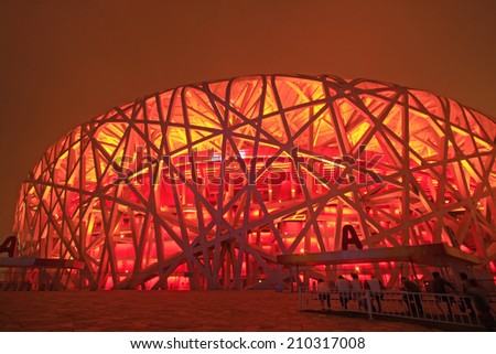 BEIJING - MAY 24: Beijing national stadium - the bird\'s nest at night, in the Beijing Olympic park, on may 24, 2014, Beijing, China