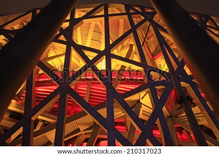 BEIJING - MAY 24: Beijing national stadium - the bird's nest local features at night, in the Beijing Olympic park, on may 24, 2014, Beijing, China