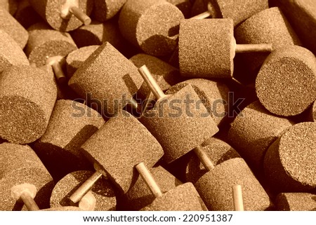grinding wheel head piled up together, closeup of photo