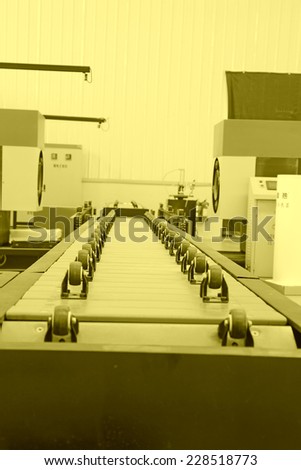 transmission device in the production line in a factory, closeup of photo