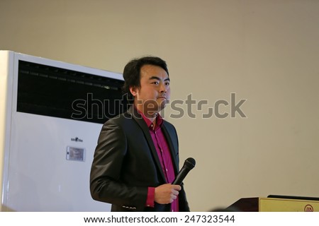 TANGSHAN CITY - DECEMBER 28: Beijing Verde, film and television equipment co., LTD., general manager Yang Tianxiao in the lecture, on December 28, 2014, Tangshan City, Hebei Province, China