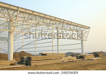 Factory workshop steel structure truss and precast concrete panel, closeup of photo