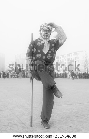 LUANNAN COUNTY - FEBRUARY 15: Sun wukong\'s image wearing colorful clothes, performing yangko dance in the street, February 15, 2014, Luannan County, Hebei Province, China.