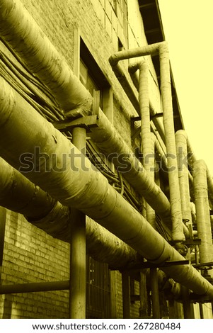 material pipe wrapped in thermal insulation in a factory