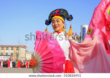 LUANNAN COUNTY - MARCH 4: traditional Chinese style yangko dance performances in the square, on march 4, 2015, Luannan County, Hebei province, China