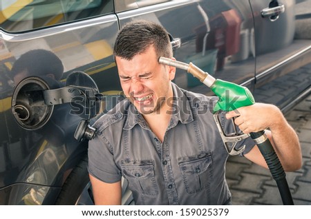 Young adult shooting himself over crazy petrol and fuel prices.