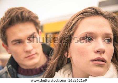 Couple during break up - Sad young woman