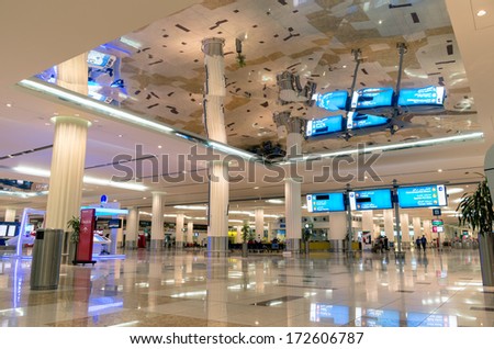 DUBAI - JANUARY 5, 2014: wide view of the huge entrance hall at Terminal 3 in Dubai International Airport. The terminal was opened on 14 October 2008 and is currently worlds largest airport terminal.