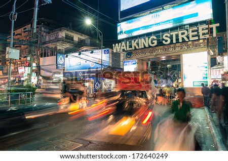 PATTAYA, THAILAND - JANUARY 19, 2014: the beginning of the Walking Street of Pattaya. The street runs from the south end of Beach Road to the Bali Hai Pier and is closed to the traffic after 6pm.