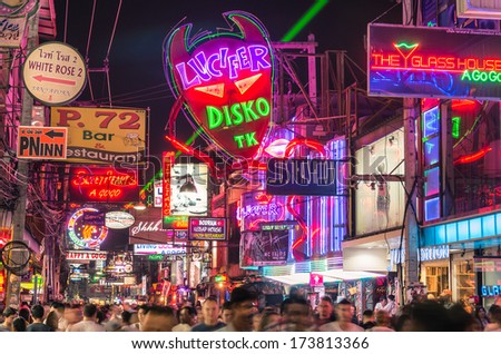 PATTAYA, THAILAND - JANUARY 19, 2014: multicolored neon signs in the heart of the Walking Street of Pattaya. The street is closed to the traffic after 6pm and stays crowded until late in the night.
