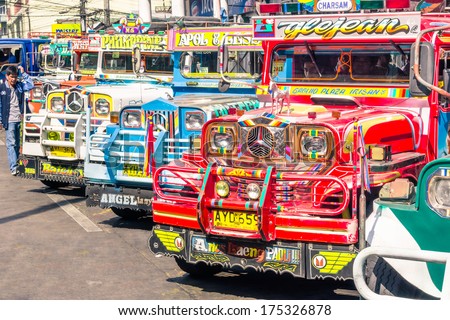 Baguio, Philippines - February 4, 2014: Colorful Jeepneys At The Bus Station Of The City Of Baguio. Inspired From Us Military Jeeps, Those Are The Cheapest And Kitschest Transportation In The Country.