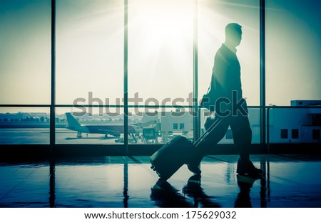 Man at the Airport with Suitcase