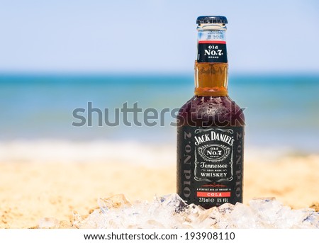 RIMINI, ITALY - MAY 18, 2014: Jack Daniel\'s and cola mixed in a mini bottled ready to drink at the beach. The new branding is offering more options like Jack & Ginger or Jack & Diet Cola.