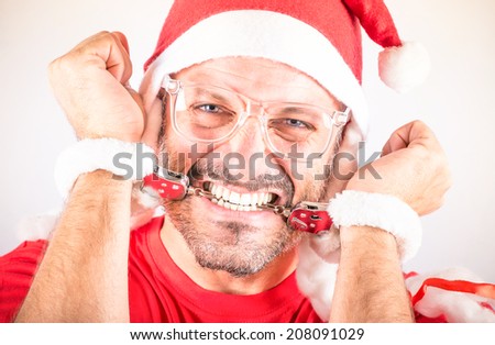 Desperate Handcuffed Santa Man - Funny concept of the Christmas holidays stress for the organization and distribution of gifts and presents