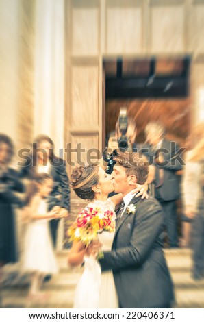 Couple of young lovers kissing during wedding cerimony - Concept of love in a very happy life moment