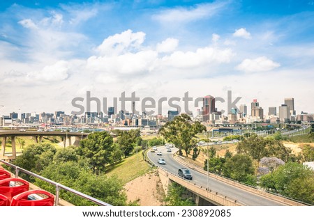 Wide angle view of Johannesburg skyline from the highways during a sightseeing tour around the urban area - Metropolitan buildings of the business district in the capital of South Africa