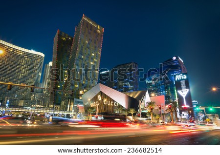 LAS VEGAS - DECEMBER 7, 2013: blurred lights on the Strip at sunset. Aria Resort and Casino is a luxury accommodation building, part of City Center complex on the Las Vegas Boulevard in Nevada Usa