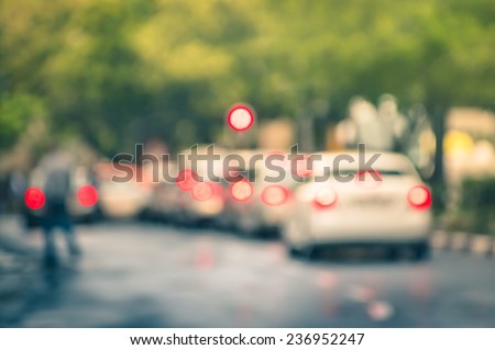 Defocused cars in city traffic jam in a rainy day - Johannesburg suburb streets with blurred bokeh