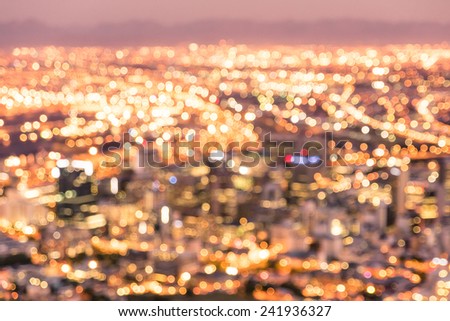 Bokeh of Cape Town skyline from Signal Hill after sunset during the blue hour - South Africa modern city with spectacular nightscape panorama - Warm blurred defocused night lights