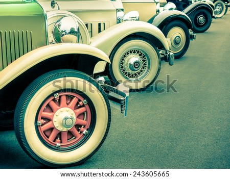 Composition of vintage car wheels - Concept of retro classic vehicles transportation