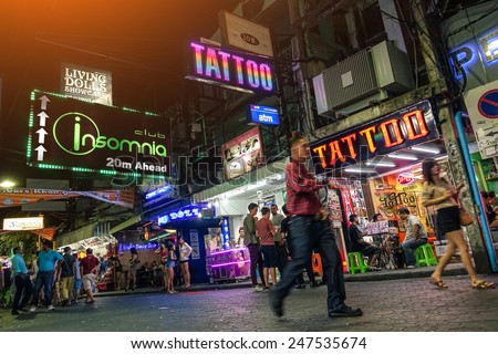 PATTAYA, THAILAND - JANUARY 17, 2015: multicolored neon signs near Insomnia Disco on the Walking Street of Pattaya. The street is closed to the traffic from 6pm until late in the night