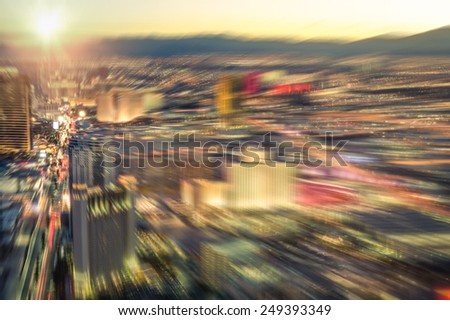 Aerial view of Las Vegas skyline at sunset - Blurred city lights from downtown strip boulevard - Vintage filtered look with radial zoom defocusing