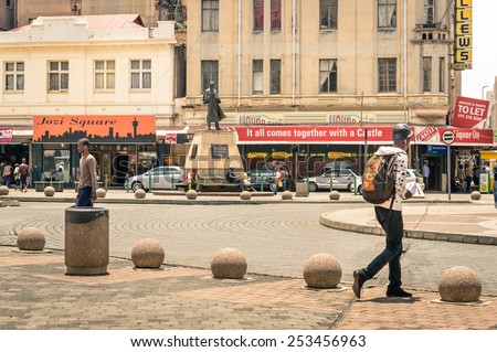 JOHANNESBURG, SOUTH AFRICA - NOVEMBER 13, 2014: everyday life at Gandhi square. After the renovation finished in 2002 the area got a renovated bus terminal , 24-hour security, and many new shops .