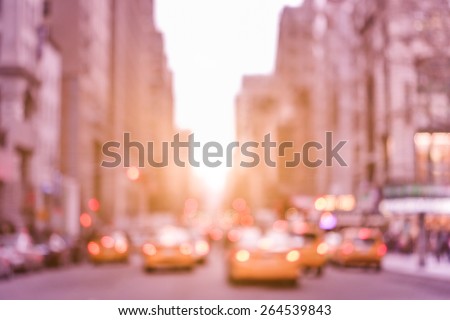 Rush hour with defocused yellow taxi cabs and traffic jam on 5th avenue in Manhattan downtown at sunset - Blurred bokeh postcard of New York City on a vintage marsala color filtered look