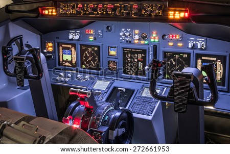 Lateral view of cockpit in homemade flight simulator - Concept of aerospace industry development - Flying simulation school for aviation learning pilots - All lights on ready for takeoff experience