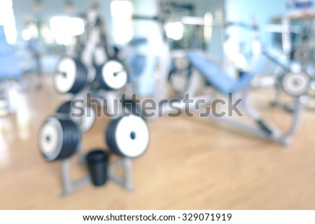 Abstract defocused gym background - Blurred bokeh of modern fitness studio club with natural light halos - Generic backdrop for healthy lifestyle concepts
